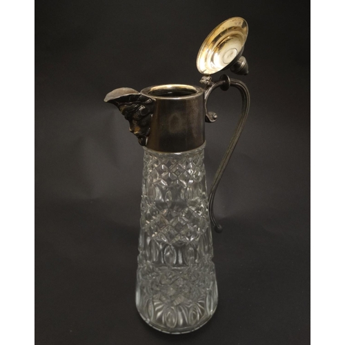 132 - A glass claret jug  with silver plate handle and mounts 11 1/2'' high overall