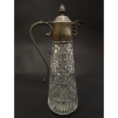 132 - A glass claret jug  with silver plate handle and mounts 11 1/2'' high overall