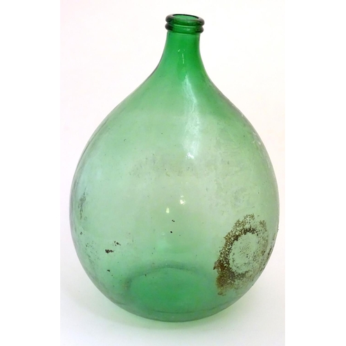 133 - Large Italian Demi-John Bottle: a large Carboy / Demi-John green glass wine bottle, 24 1/2'' high.