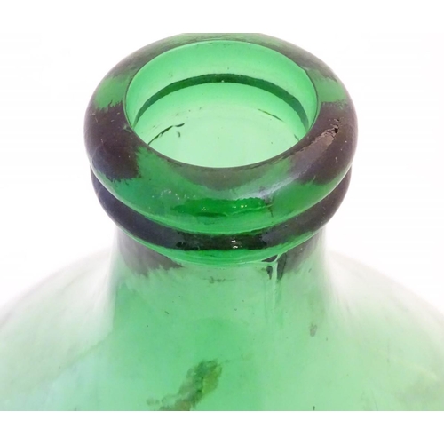 133 - Large Italian Demi-John Bottle: a large Carboy / Demi-John green glass wine bottle, 24 1/2'' high.