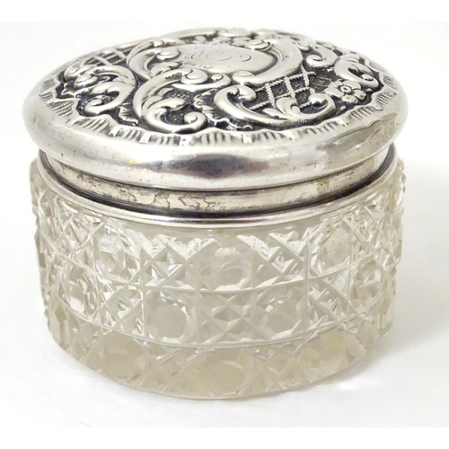 139 - 2 cut glass dressing table jars with silver tops one hallmarked Birmingham 1900 maker The Alexander ... 