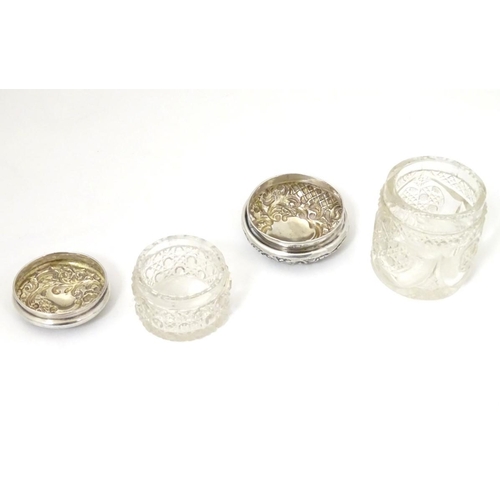 139 - 2 cut glass dressing table jars with silver tops one hallmarked Birmingham 1900 maker The Alexander ... 