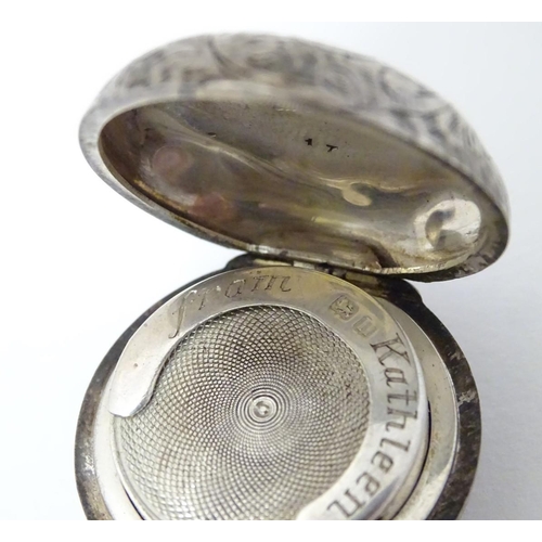 145 - A silver sovereign case with engraved acanthus scroll decoration. Hallmarked Birmingham 1912 maker W... 