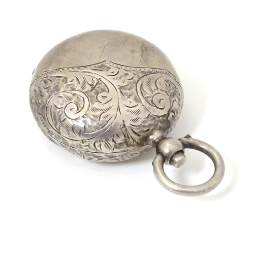 145 - A silver sovereign case with engraved acanthus scroll decoration. Hallmarked Birmingham 1912 maker W... 