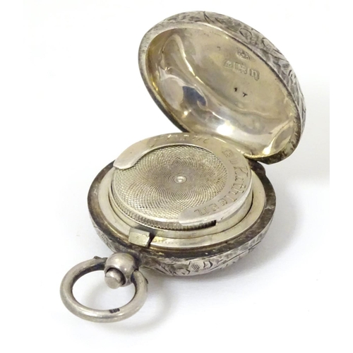 145 - A silver sovereign case with engraved acanthus scroll decoration. Hallmarked Birmingham 1912 maker W... 