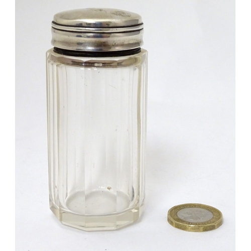 147 - A glass jar with silver top 3 1/4'' high