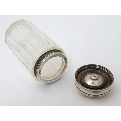 147 - A glass jar with silver top 3 1/4'' high