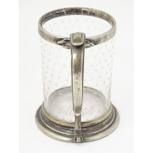 151 - A cut glass cruet bottle with silver mount hallmarked London 1857 together with a A cut glass tankar... 