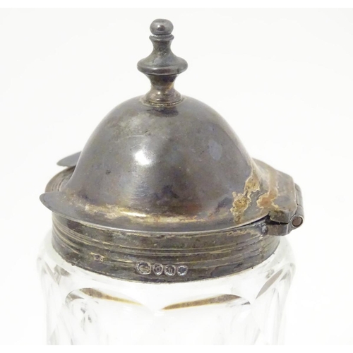 151 - A cut glass cruet bottle with silver mount hallmarked London 1857 together with a A cut glass tankar... 