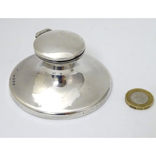 153 - A silver capstan formed inkwell hallmarked Birmingham 1913 maker Henry Clifford Davis.