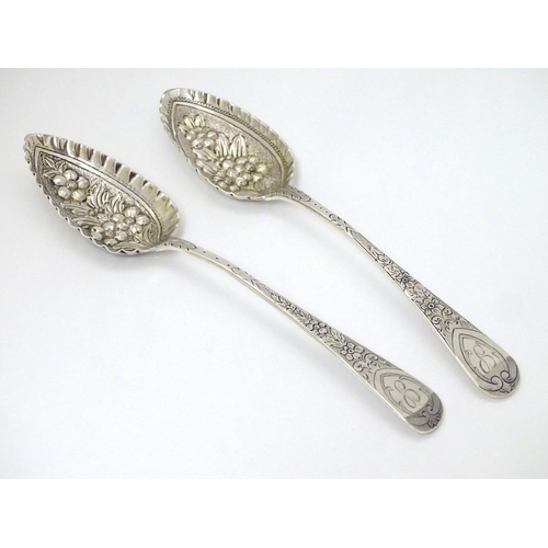 156 - A matched pair of silver berry spoons, hallmarked London 1808 one by William Eley, William Fern and ... 