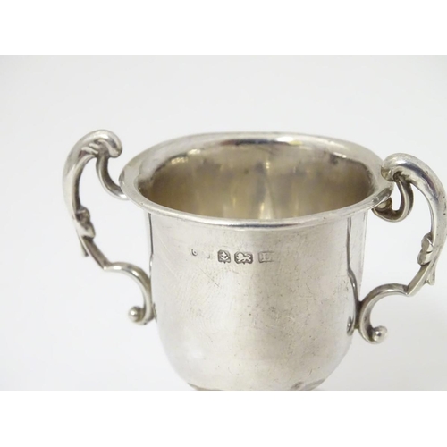 169 - A miniature silver two handled trophy cup hallmarked Birmingham 1929 2'' high (24g)