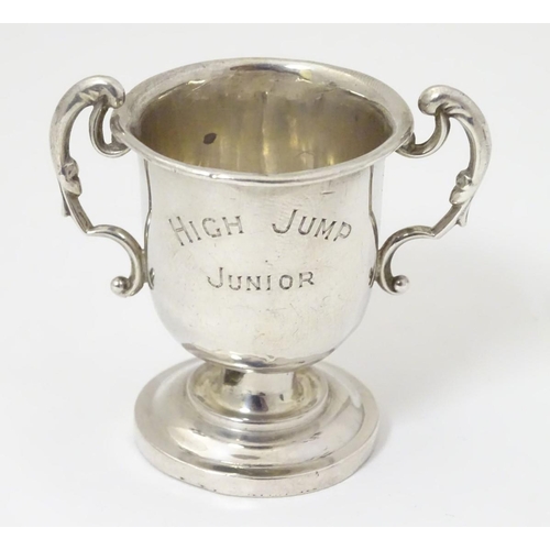 169 - A miniature silver two handled trophy cup hallmarked Birmingham 1929 2'' high (24g)