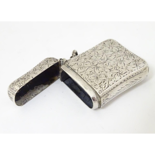 176 - A silver vesta case with engraved decoration Hallmarked Birmingham 1898 maker E V Pledge & Son. 1 3/... 