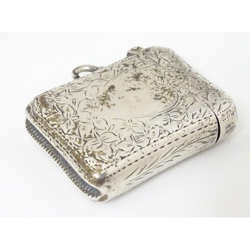 176 - A silver vesta case with engraved decoration Hallmarked Birmingham 1898 maker E V Pledge & Son. 1 3/... 