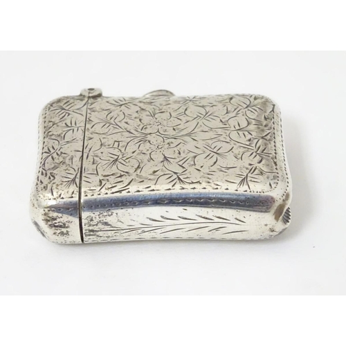 176 - A silver vesta case with engraved decoration Hallmarked Birmingham 1898 maker E V Pledge & Son. 1 3/... 