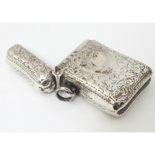 176 - A silver vesta case with engraved decoration Hallmarked Birmingham 1898 maker E V Pledge & Son. 1 3/... 