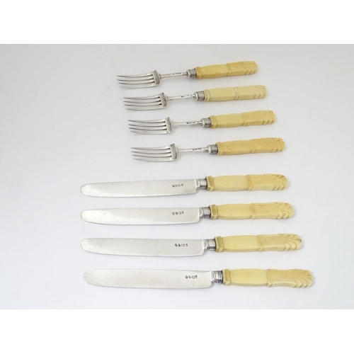 177 - 4 + 4 silver fruit knives and forks with ivory handles hallmarked 1818 maker JL. Approx  7 3/4''