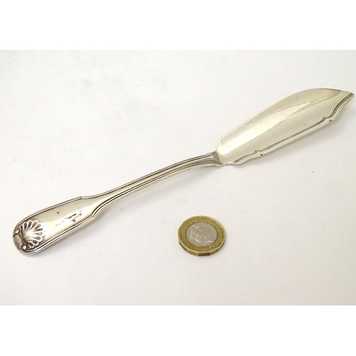 179 - A Victorian silver fiddle shell and thread pattern butter knife hallmarked London 1841. 8'' long (56... 