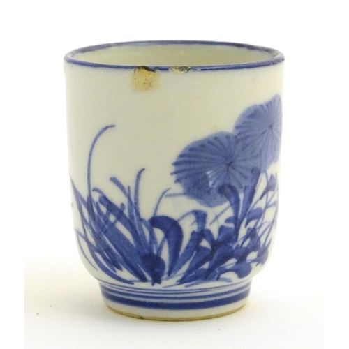 18 - A Japanese blue and white pot with hand painted floral and foliate decoration. Character marks to ba... 