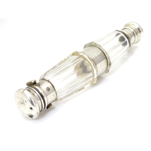 184 - A facet cut glass double end scent  bottle with silver plate mounts. 5 1/4'' long overall