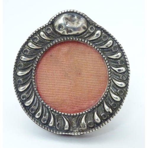 186 - A miniature photograph frame with silver surround. Hallmarked Birmingham 1901 2'' high