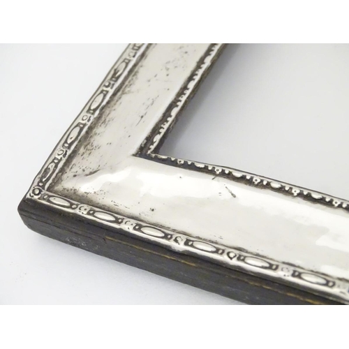 196 - A silver mounted photo frame hallmarked Birmingham 1911 maker Green & Cadbury Ltd. 7 1/2'' x 5 1/4''... 