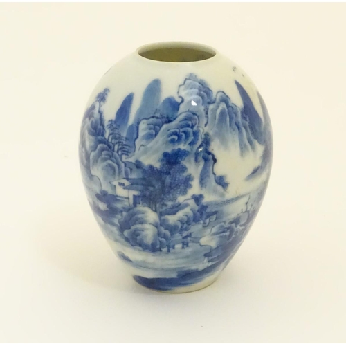 20 - A small Chinese blue and white vase, decorated with a landscape to include mountains, bridges, boats... 