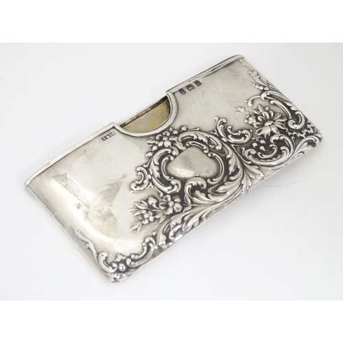 200 - A silver card case with embossed decoration. Hallmarked Birmingham 1903 maker Sydney & Co. 3'' wide ... 