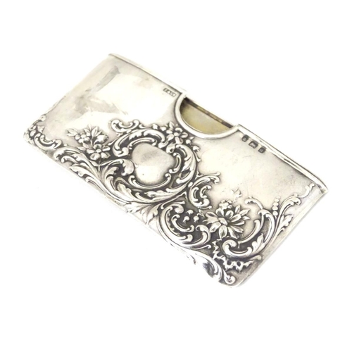 200 - A silver card case with embossed decoration. Hallmarked Birmingham 1903 maker Sydney & Co. 3'' wide ... 