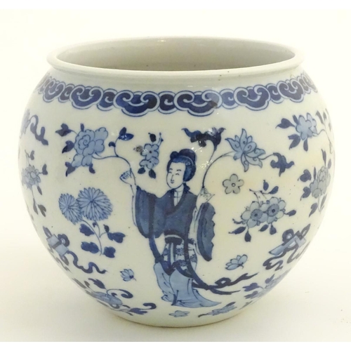 21 - A blue and white Oriental jardiniere, decorated with figures in traditional dress and flowers. Marke... 