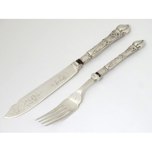 215 - A silver handle fish knife and fork hallmarked Birmingham 1906