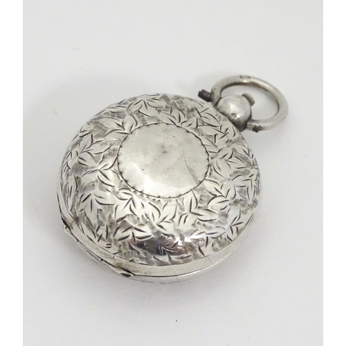 229 - A silver sovereign case with engraved decoration. 1 1/4'' diameter