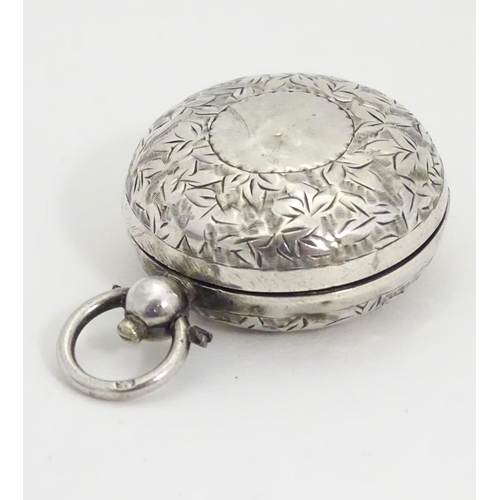 229 - A silver sovereign case with engraved decoration. 1 1/4'' diameter