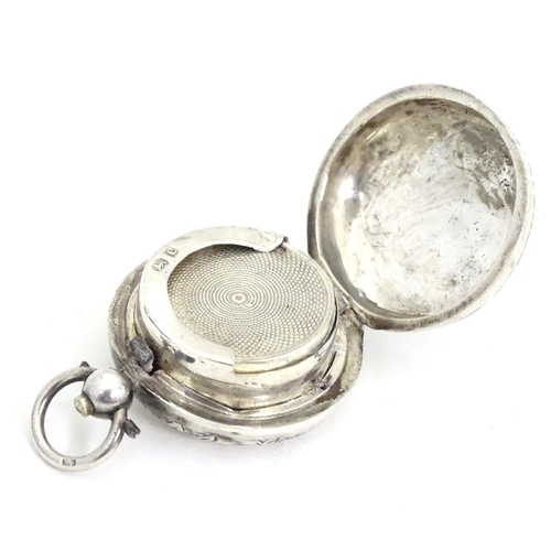 229 - A silver sovereign case with engraved decoration. 1 1/4'' diameter