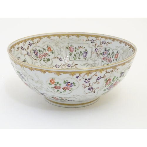 38 - An 18thC Chinese bowl with panelled floral decoration. Approx. 3 3/4'' high x 9'' diameter.