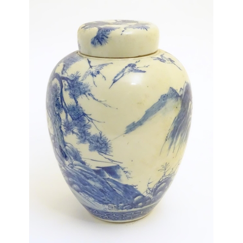 4 - A large blue and white Japanese lidded ginger jar decorated with a sage sat by a tree in a landscape... 