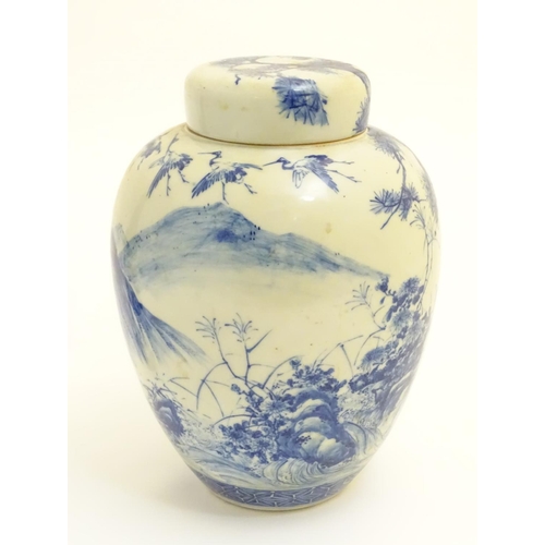 4 - A large blue and white Japanese lidded ginger jar decorated with a sage sat by a tree in a landscape... 