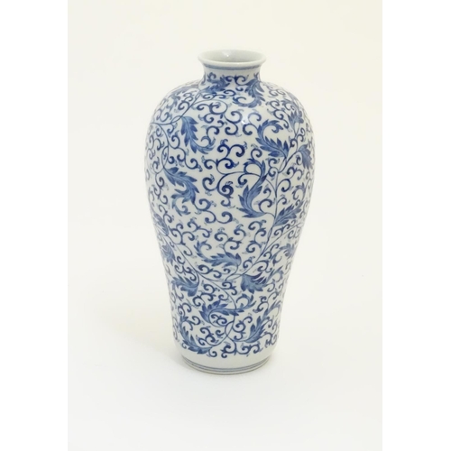 40 - A Chinese blue and white 'Plum' vase decorated with scrolling foliage. Character marks under. Approx... 