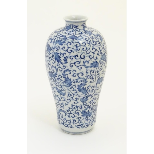 40 - A Chinese blue and white 'Plum' vase decorated with scrolling foliage. Character marks under. Approx... 