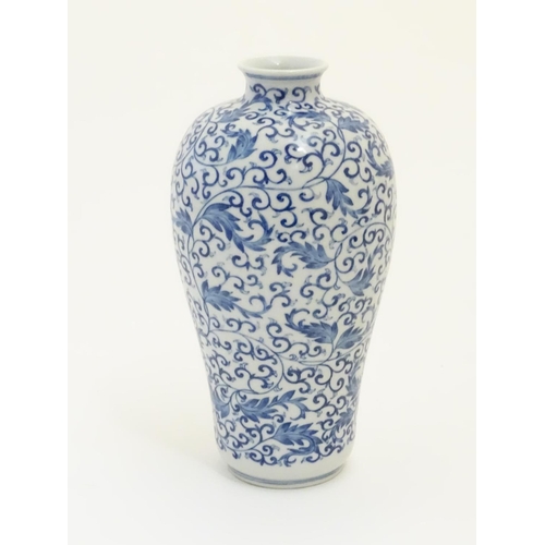 40 - A Chinese blue and white 'Plum' vase decorated with scrolling foliage. Character marks under. Approx... 