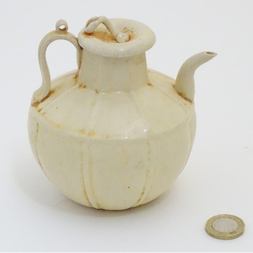 45 - A Chinese white celadon style small proportion wine ewer, with a crackle glaze and ridged decoration... 