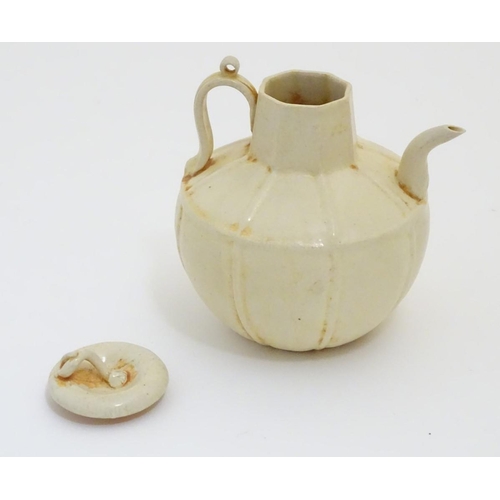 45 - A Chinese white celadon style small proportion wine ewer, with a crackle glaze and ridged decoration... 