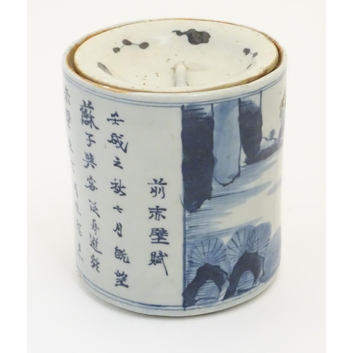 46 - A 19thC Chinese blue and white lidded pot / biscuit barrel decorated with Chinese script and a water... 