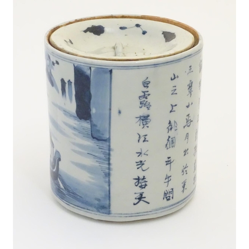 46 - A 19thC Chinese blue and white lidded pot / biscuit barrel decorated with Chinese script and a water... 