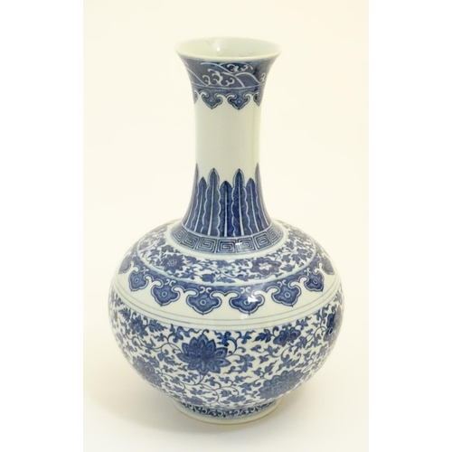 5 - A Chinese blue and white 'Shang Ping' vase decorated with a broad band of flowers and scrolling foli... 