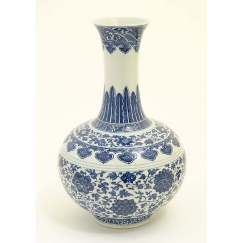 5 - A Chinese blue and white 'Shang Ping' vase decorated with a broad band of flowers and scrolling foli... 