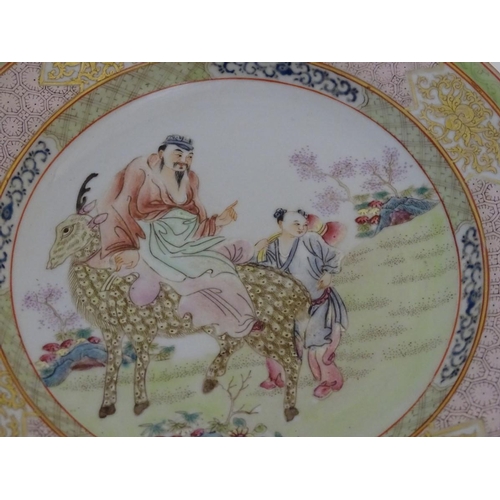 51 - A Chinese famille rose plate decorated with Shou-Lao, the God of Longevity, riding a spotted deer in... 