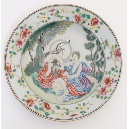 54 - A Chinese export famille rose plate, depicting a mythological scene of Apollo playing his lyre, seat... 