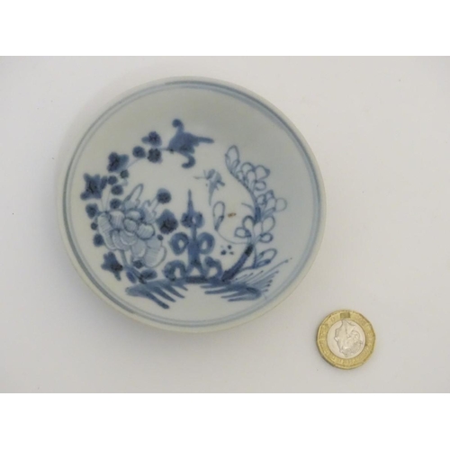 59 - A small 18thC Chinese blue and white dish, with hand painted decoration of a stylised pagoda and flo... 